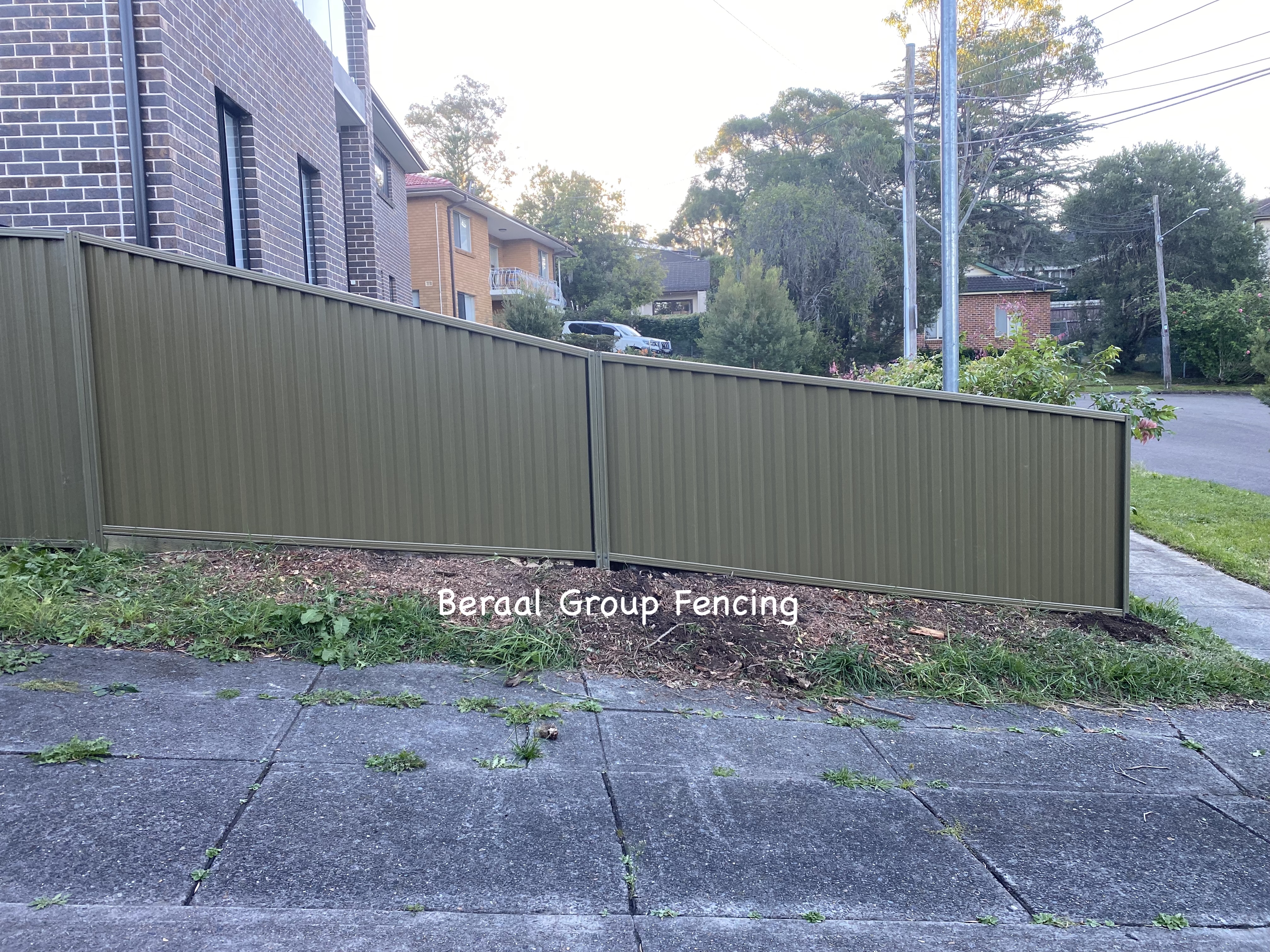 Colorbond fence with raked installation